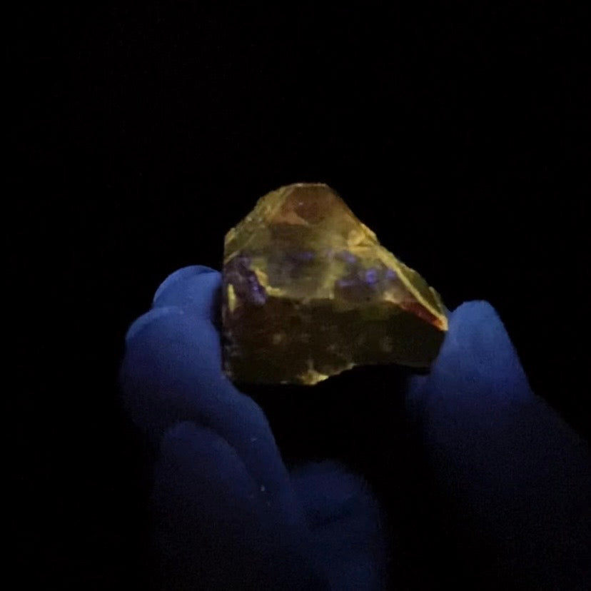 Zircon Crystal with Bright Yellow Fluorescent Apatite Inclusions