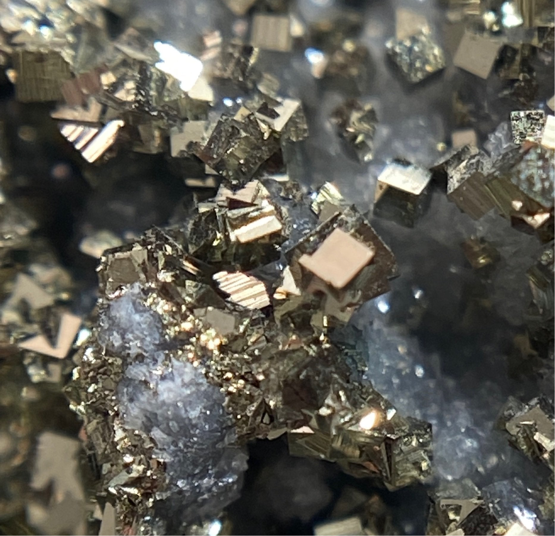 Druzy Cubic Pyrite Crystals over Fluorescent Calcite