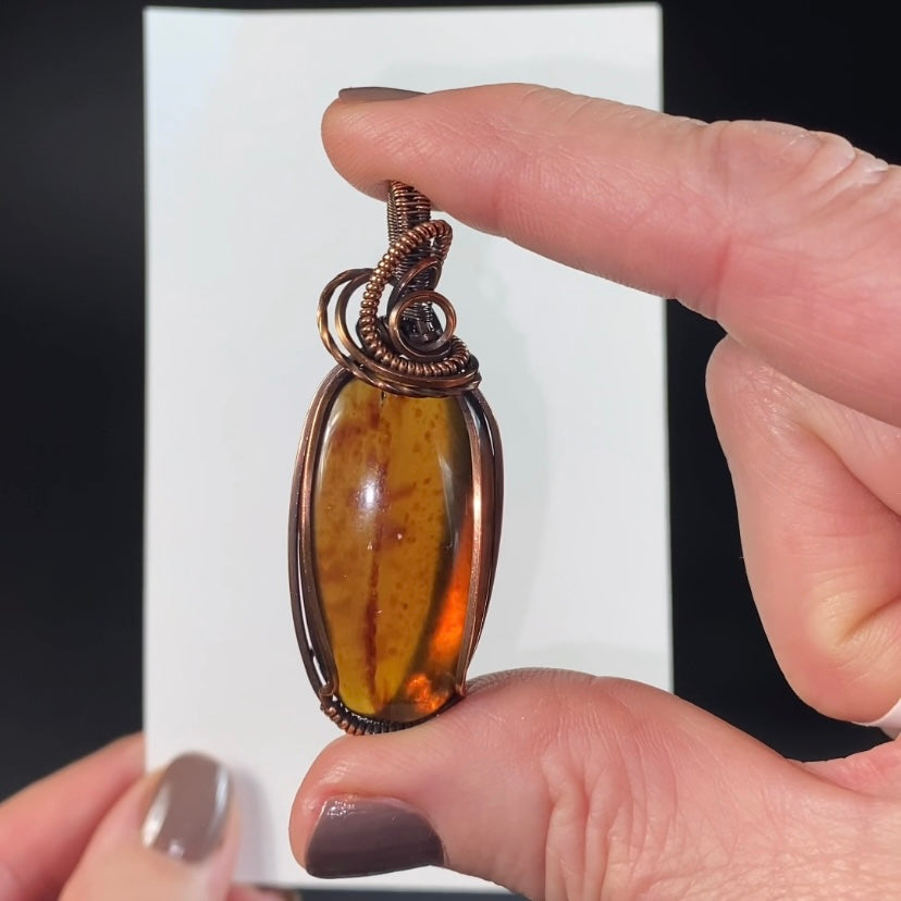Blue Sumatran Amber and Copper Wire Wrapped Pendant