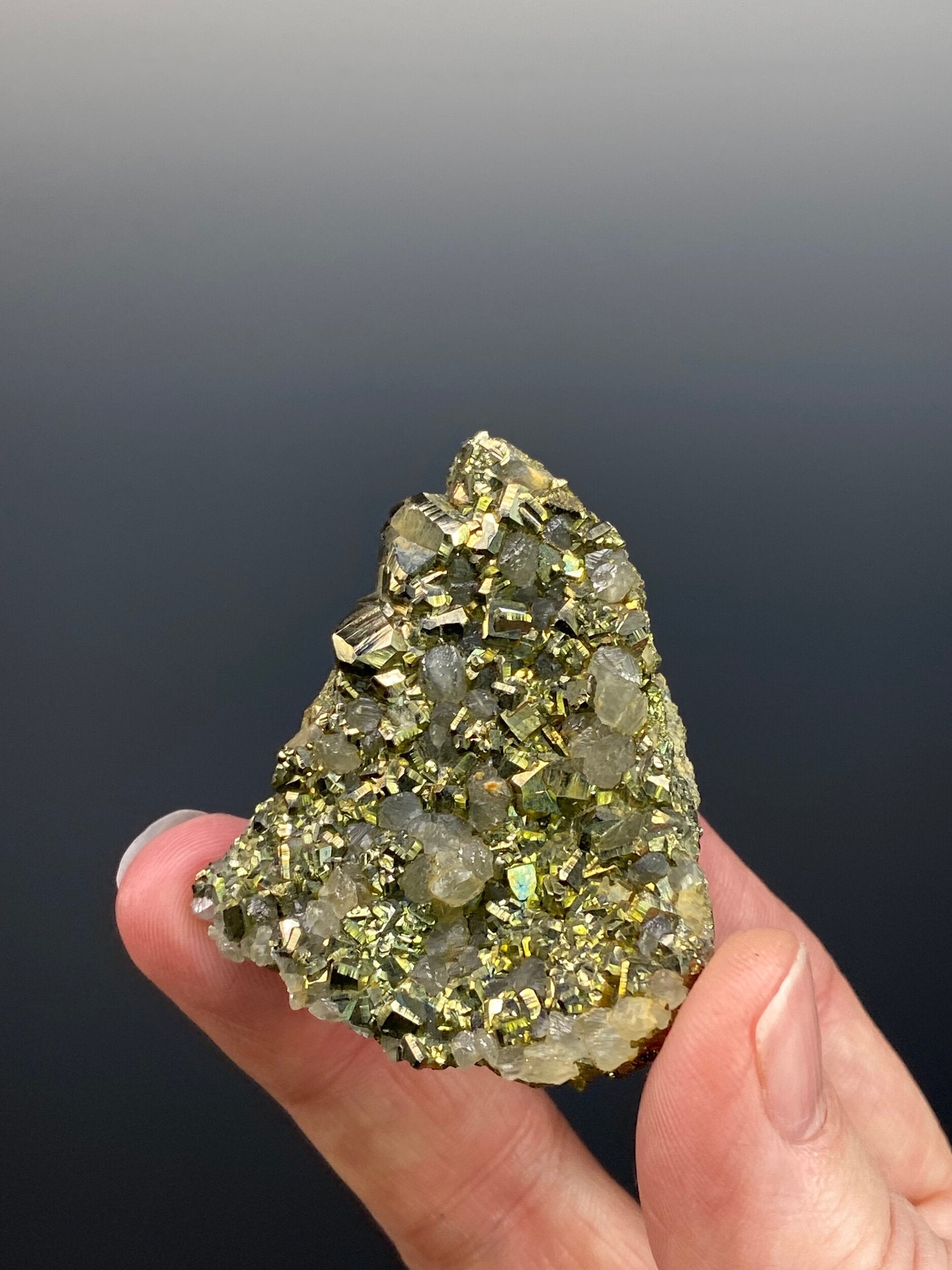 Cubic Pyrite Cluster with Fluorescent Calcite Crystals