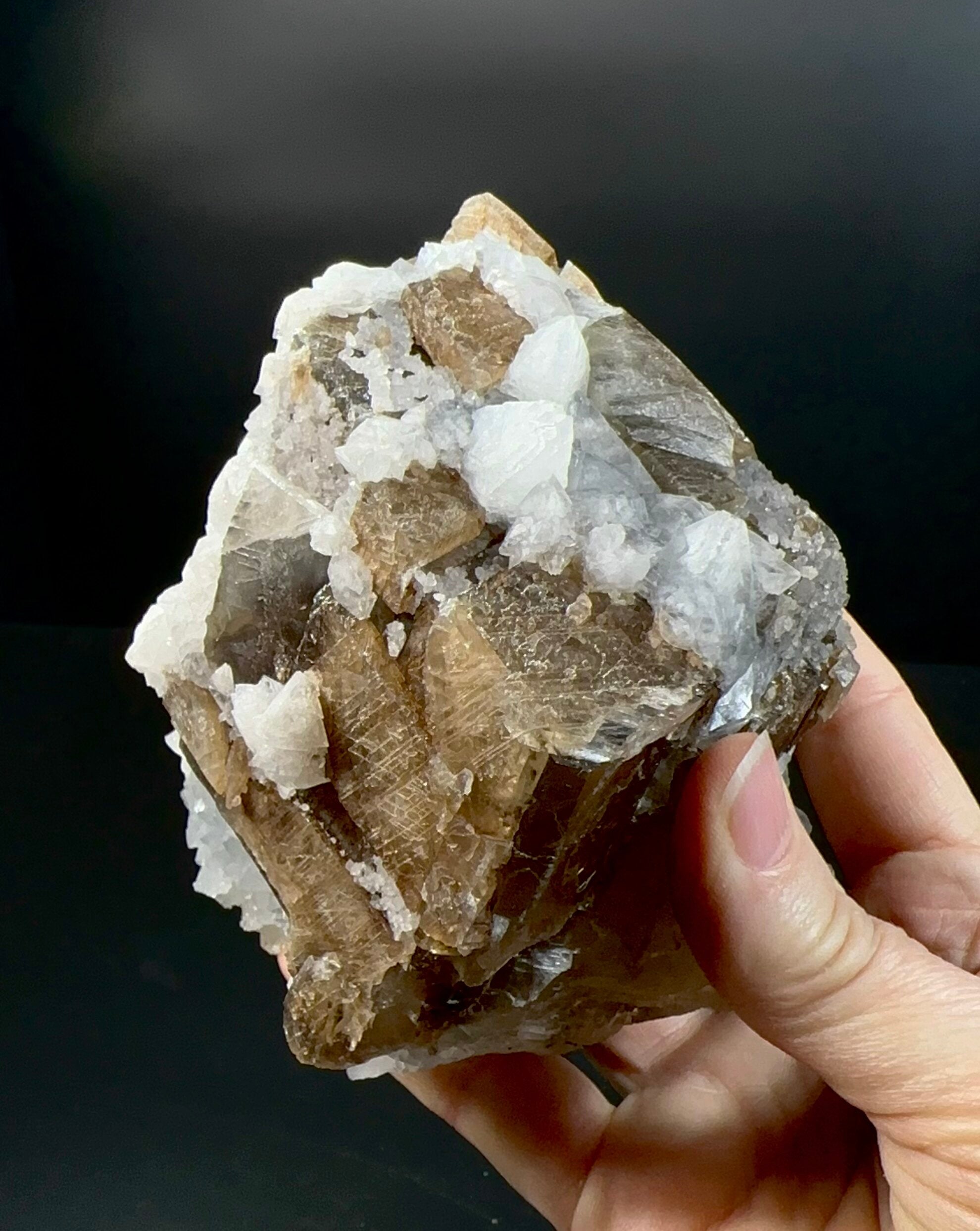 Brown Rhombohedral Calcite Crystals with Intergrown Clear Apophyllite and Fluroescent Powellite in Basalt Pocket