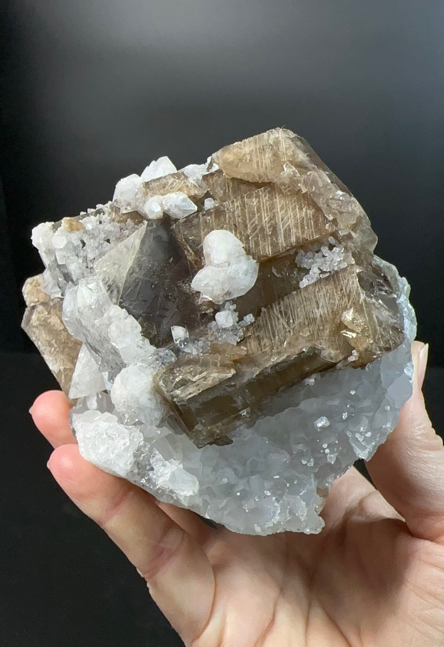 Brown Rhombohedral Calcite Crystals with Intergrown Clear Apophyllite and Fluroescent Powellite in Basalt Pocket