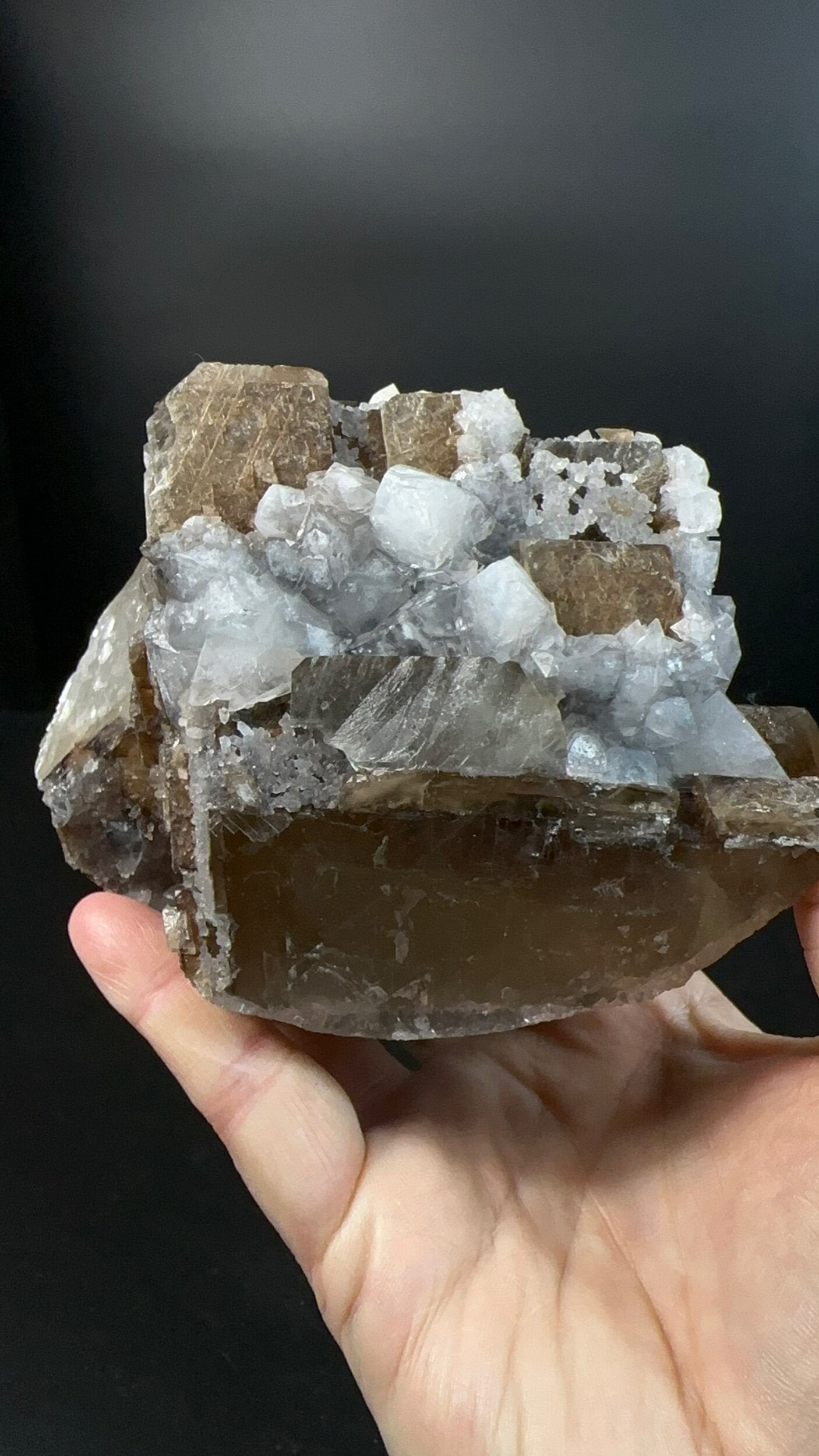 Brown Rhombohedral Calcite Crystals with Intergrown Clear Apophyllite and Fluroescent Powellite in Basalt Pocket