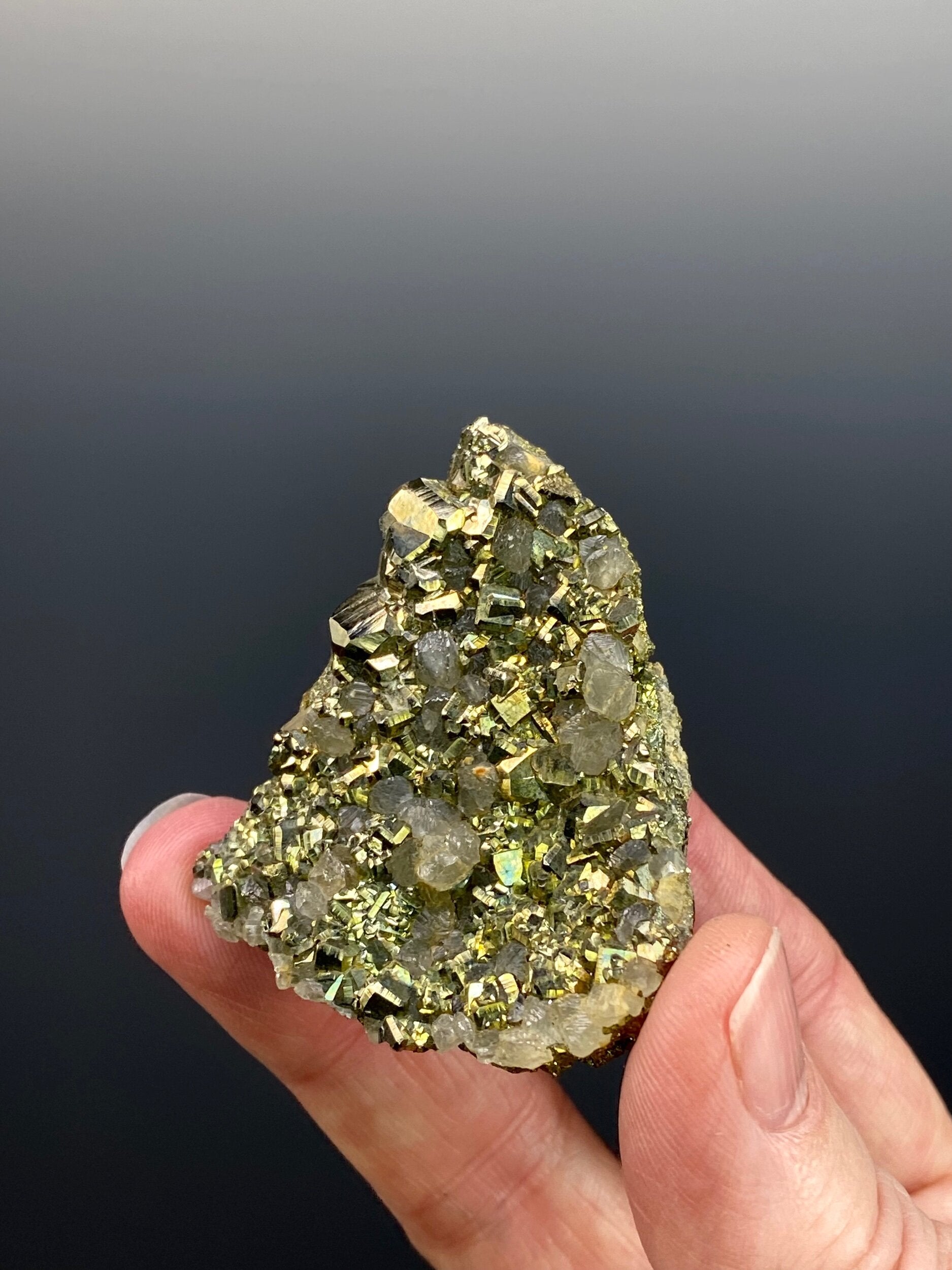 Cubic Pyrite Cluster with Fluorescent Calcite Crystals