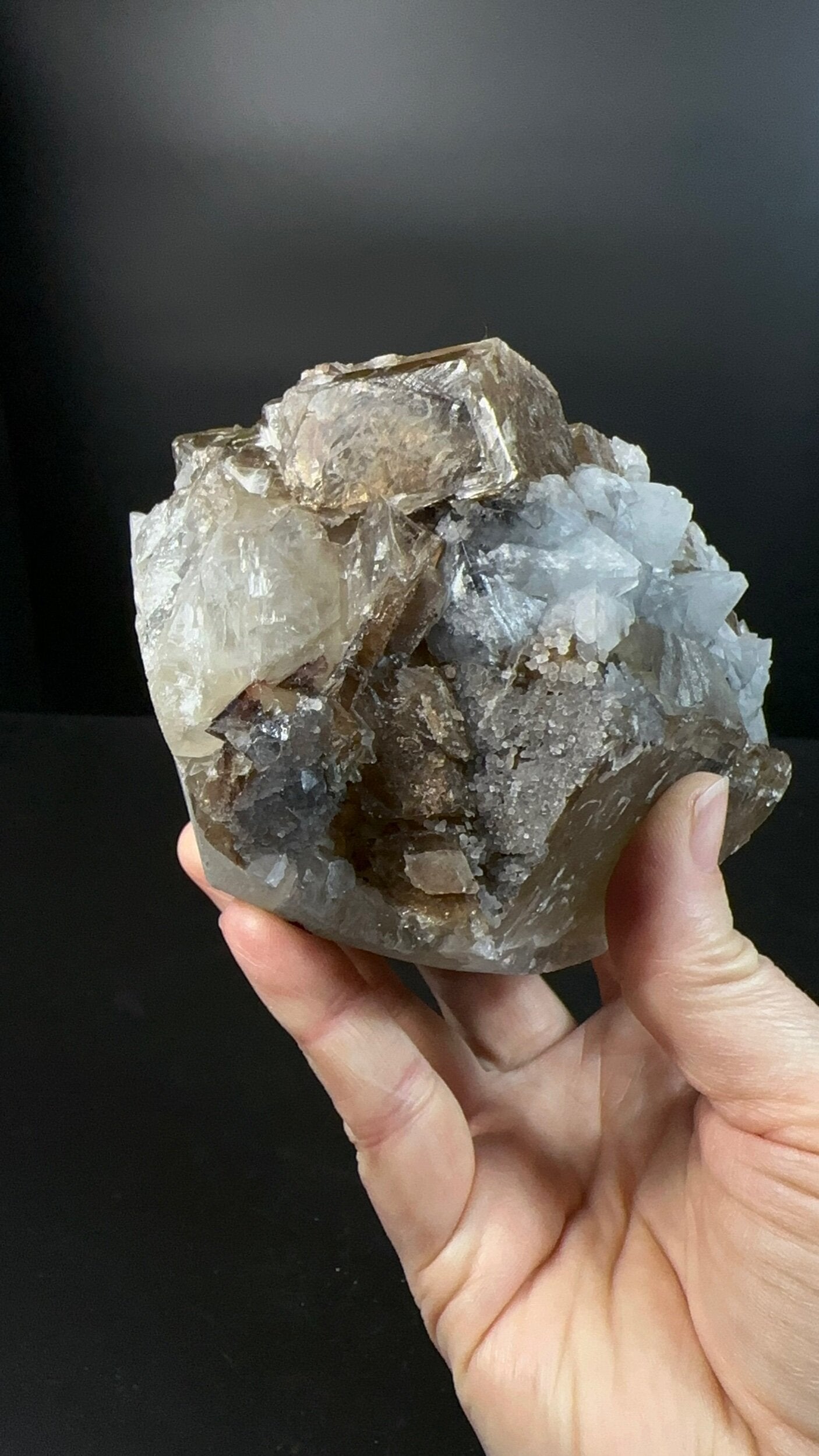 Brown Rhombohedral Calcite Crystals with Intergrown Clear Apophyllite and Fluroescent Powellite in Basalt Pocket